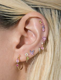 a close up of a person with ear piercings