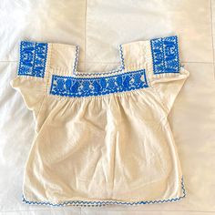 Cotton Blouse With Blue Embroidery, Perfect For Summer. Blue Cotton Tops With Motif, Traditional Blue Tops With Motif, Handmade Blue Tops For Festival, Handmade Bohemian Blue Tops, Handmade Blue Bohemian Tops, Handmade White Cotton Tops, White Cotton Yoke Top, Handmade White Short Sleeve Tops, Handmade White Folk Top