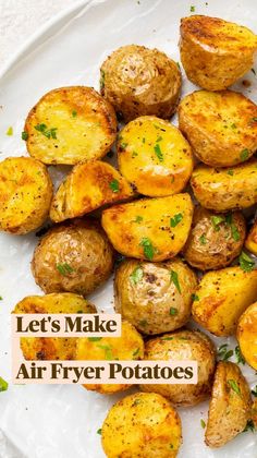 a white plate topped with potatoes covered in parsley