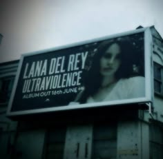 an advertisement for lana del ray's ultraavvolunce is shown on the side of a building