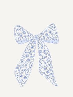 a blue and white bow with flowers on it