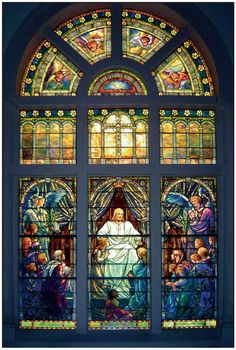 a stained glass window depicting the birth of jesus