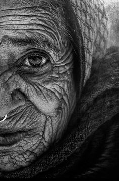 black and white photograph of an old woman with wrinkles