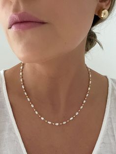 "D E T A I L S - 18K Gold Filled, Freshwater Pearls Synthetic - 16\" length with a 2\" extender - Lobster Clasp  M A T E R I A L S At Dylan Rae, we are committed to handcrafting jewelry that is perfect for everyday wear. Our high-quality gold filled designs contain 100+ times more real gold than gold plated components. The thick outer layer of gold makes it highly durable and safe for people with allergies or sensitive skin. C A R E Care for Your Gold Filled Jewelry: Wear It, Love It, Care for It! Our gold-filled pieces are crafted to be your lifelong companions. Feel free to wear them every day, even while showering, but remember to avoid exposing them to saltwater and chlorine. These elements can diminish their luster over time and may even cause oxidation if they come in contact with yo Affordable 8mm Bead Pearl Necklace, Dainty Pearl Necklace, Diy Jewelry Necklace, Jewelry Dainty, Freshwater Pearl Necklace, Necklace Minimalist, Shell Jewelry, Freshwater Pearl Necklaces, Gold Filled Jewelry