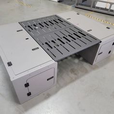 an office desk made out of two drawers and one drawer on the bottom is open