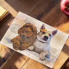 a dog is sitting next to an apple on a table with jigsaw puzzles