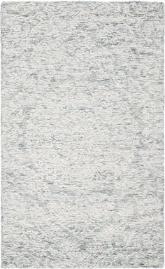 an area rug with grey and white colors