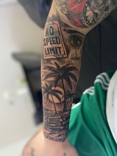 a man with a tattoo on his arm that says no speed limit and palm trees