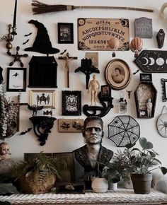 there are many pictures on the wall above the man's head and other decorations