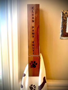 a towel rack with a paw print on it