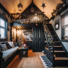 a living room filled with lots of furniture and christmas lights on the wall above it