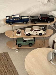 a skateboard shelf with cars and trucks on it