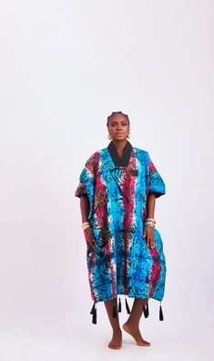 Introducing our exquisite one-size-fits-all kaftan-style dress, where comfort meets artisanal elegance. Each piece is meticulously crafted from luxurious handcrafted tie-dye adire fabric, ensuring a unique and captivating look for every wearer. Embrace the relaxed silhouette of this loose-fitted dress, offering both comfort and style in equal measure. Whether you're lounging by the pool or exploring the city streets, this versatile piece effortlessly transitions from day to night with effortless grace. Indulge in the sumptuous feel of handcrafted tie-dye adire fabric, renowned for its softness and luxurious texture, ensuring you feel as fabulous as you look. Each dress is a testament to the rich cultural heritage and skilled craftsmanship of West Africa. Designed to flatter all body types, Adire Fabric, Kaftan Style Dresses, Kaftan Style, Dress Drape, Loose Fitting Dresses, Cultural Heritage, Bag Dress, West Africa, British Indian Ocean Territory