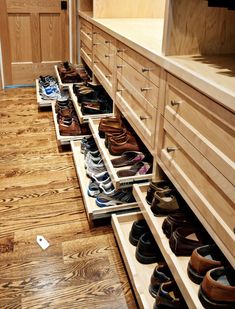 there are many pairs of shoes in the drawers on the floor next to each other