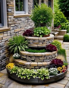 an outdoor garden with stone steps and plants in the center, surrounded by brick walls