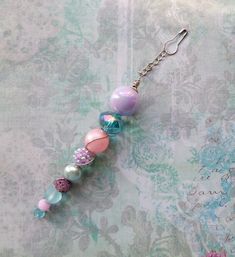 a close up of a key chain with beads