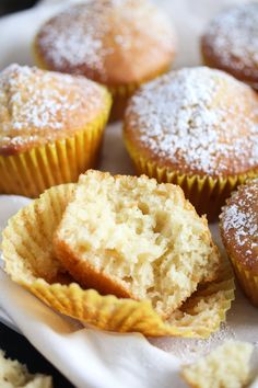 muffins on a plate with powdered sugar