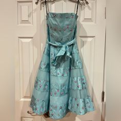 Betsey Johnson Evening Blue Floral Puffy Dress. Size: 6. Comes With Detachable Straps. Embroidered Rosettes. Multiple Layers Of Lining. Ribbon Is Removable. Side Zipper. Comes With Extra Buttons. Shell And Lining 100% Polyester. Other Linings Are Tulle And Satin. Dry Clean Only. Vintage Style. New With Tags And (Sadly) Never Worn (Only Tried On In My House In The Photos). In Great Condition. Blue Strapless Dress For Garden Party, Strapless Blue Dress For Garden Party, Blue And Purple Dress, Blue Silk Dress For Garden Party, Silk Blue Dress For Garden Party, Blue Lined Wedding Dress, Blue Silk Lined Dress, Betsy Johnson Dresses Vintage, Vintage Betsey Johnson Dress