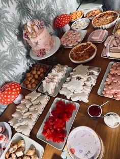 a table filled with lots of food and desserts