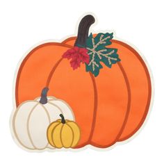 an orange and white pumpkin with leaves on it