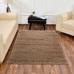 a living room with two couches and a coffee table