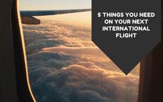 an airplane window with the words 5 things you need on your next international flight