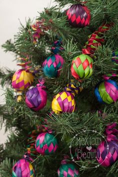 a christmas tree decorated with brightly colored ornaments