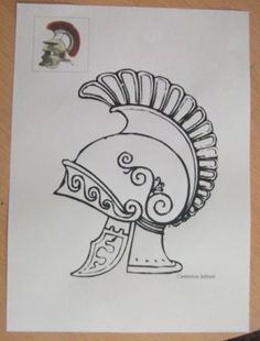 a drawing of a helmet on top of a piece of paper