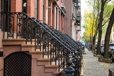 a row of browns houses with wrought iron railings