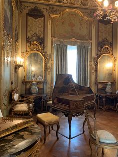 an ornately decorated room with a grand piano