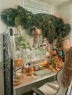 a desk with some plants on it and a chair in front of the desk area