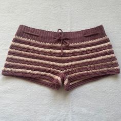 the shorts are knitted and have stripes on them