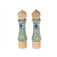 two wooden salt and pepper shakers with blue flowers on green ground, one has the letter s