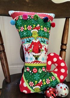 a christmas stocking sitting on top of a wooden chair