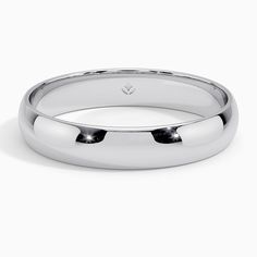 a white gold wedding ring on a white background