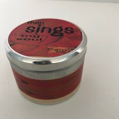 there is a small tin with the words then sings on it