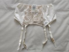 A Vintage NWT Suspender/Garter Belt by Warner's Lingerie from their lovely 'Richness' range, in size 10-12/Aus/UK, 5-6/US, in an all cream/taupe nylon and lace finish. Quadruple clasp on back and 4 suspenders. Colour - Off White Vintage Lingerie, Suspenders, Vintage Suspenders, Vintage Garter, Lingerie Vintage, Suspenders For Women, Garter Belts, Suspender Belt, Socks And Hosiery