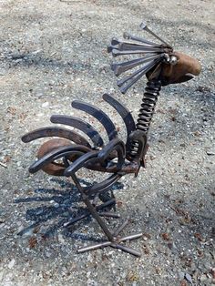 a metal sculpture made to look like a bird