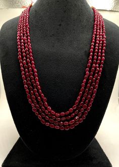 Item Name Natural Bangkok Ruby Beads Necklace, Ruby 4 Stand Beautiful Necklace, Precious Ruby Smooth Oval Beads Necklace Set, Ruby Beads Necklace  : Some Of The Sizes Are Ready To Ship. Product             :     Necklace Set Band Color       :     Gold  Gemstone        :     Natural Bangkok Ruby  Chain Style      :     Beads    . Chunky Ruby Necklace, Layered Ruby Necklace, Luxury Oval Beads Beaded Necklace For Gift, Luxury Ruby Temple Necklace, Red Oval Beaded Single Strand Necklace, Red Necklaces With Polished Oval Beads, Red Pearl Necklace With Gemstone Beads, Elegant Gemstone Oval Beads, Traditional Red Beaded Necklace For Formal Occasions