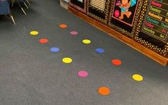 colorful polka dots are on the floor in an classroom