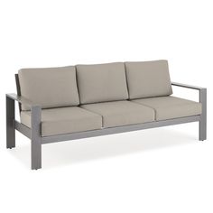 an outdoor sofa with four cushions on it's back end and armrests