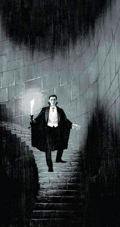 a man walking up some stairs in the dark