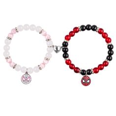 two bracelets with red and black beads, one has a charm on the clasp