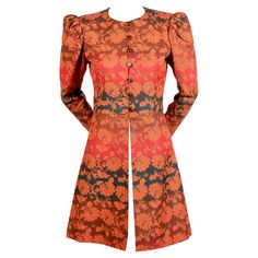 Vivid gradient colored floral coat with puff sleeves from Yves Saint Laurent dating to 1970. Coat best fits a US size 2 or 4. Approximate measurements: shoulder 14", bust 35", empire waist 30", arm length 23", underarm to cuff 16.5" and overall length 34". Fabric is a sturdy cotton twill blend. Fully lined. Brown button closure. Metal zippers at wrists. Made in France. Very good condition. Quilted Jacket Pattern, Batik Kombinasi, Floral Coat, Polka Dot Blazer, Black Velvet Jacket, Designer Coats, French Fashion Designers