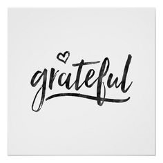 the word grateful written in black ink on a white paper with a heart shaped frame