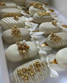 white and gold decorated chocolates in a box