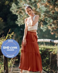 Our exquisite Pure Silk Tiered Maxi Skirt in Burnt Orange / Rust is one of my favourite pieces. Designed by me in Europe and crafted with utmost care by our fine silk artisans, this skirt is elegant, sophisticated and on trend with the gorgeous rust colour that is THE colour of the season. Made from 16 momme silk which has the most luxurious feel, this skirt offers a floaty drape that gracefully flows as you move. The sandwashed finish adds a subtle sheen and a suede-like softness to the fabric. The carefully placed tiers cascade down the skirt, creating a beautiful flow.  It's a little bit whimsical, a little dreamy and a little boho but 100% gorgeous.  You could dress it up with a silk blouse and heels for a formal event or dress it down with a casual tee and sandals for a relaxed outing Orange Maxi Skirt, Skirts Flowy, Long Skirt Summer, Silk Maxi Skirt, Maxi Skirts, Silk Gifts, Orange Skirt, Evening Cocktail, Party Rock