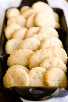 some biscuits are in a black pan on a table