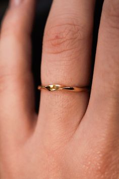 The Möbius Band features a continuous wave design that embodies unity and infinity. The ring is handcrafted out of a D-shaped (half round) metal, featuring a single ribbon-like wave. This listing is for ONE single ring in 14K Gold Fill The thickness of the metal used with this ring measures approximately 2mm which gives this piece a durable and sturdy design while maintaining that effortless look. While this ring is gorgeous on its own, we think it makes a lovely stack when combined with the Ex Minimalist Twisted Jewelry For Anniversary, Gold Curved Rings For Gifts, Curved Gold Rings For Gifts, Gold Curved Rings For Gift, Curved 14k Gold Jewelry For Anniversary, 14k Gold Curved Jewelry For Anniversary, Wavy Yellow Gold Jewelry For Formal Occasions, Formal Yellow Gold Wavy Jewelry, Gold Curved Jewelry With A Modern Twist