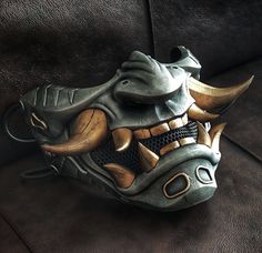 Oni cyberpunk half mask. This is an original Oni mask created by the Maskitto team. The height of the mask (with fangs) is 155 mm, the width is 205 mm. depth 125 mm. The mask fits perfectly on an adult's head and has holes for a strap.The mask is hand painted. Fangs Mask, Troll Mask, Samurai Mask, Oni Maske, Oni Samurai, Ronin Samurai, Wolf Mask, Old Ties, Horror Masks